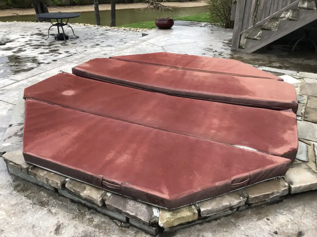 Red octagonal spa cover with a visible center gap