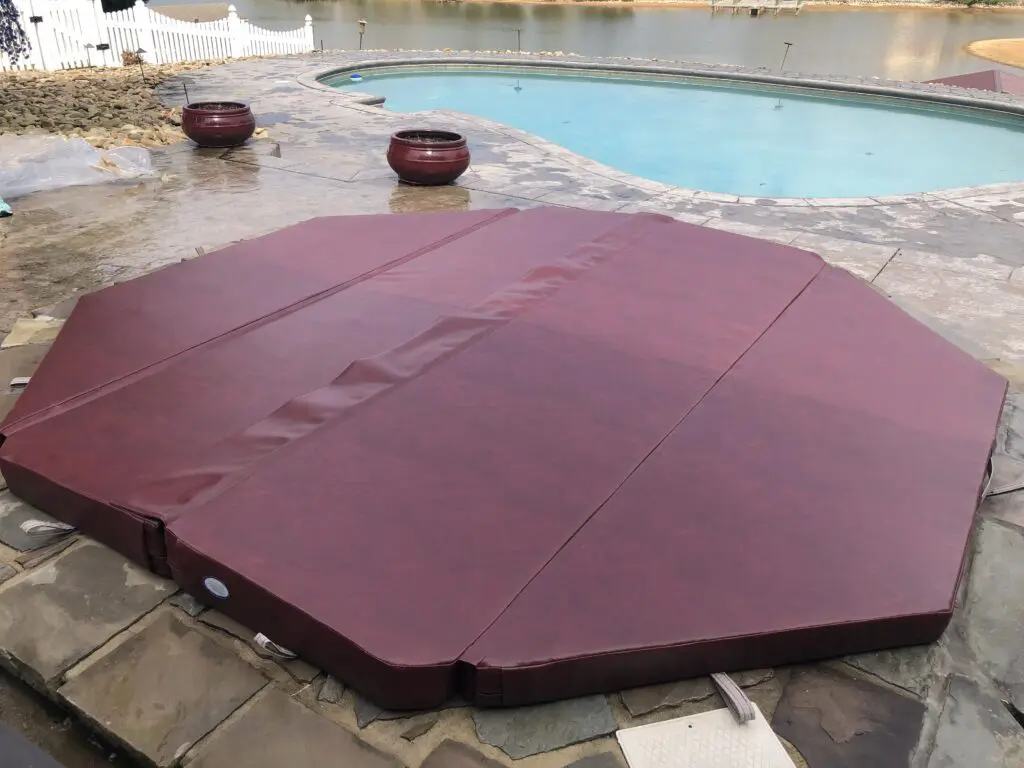 Burgundy octagonal spa cover viewed from the side